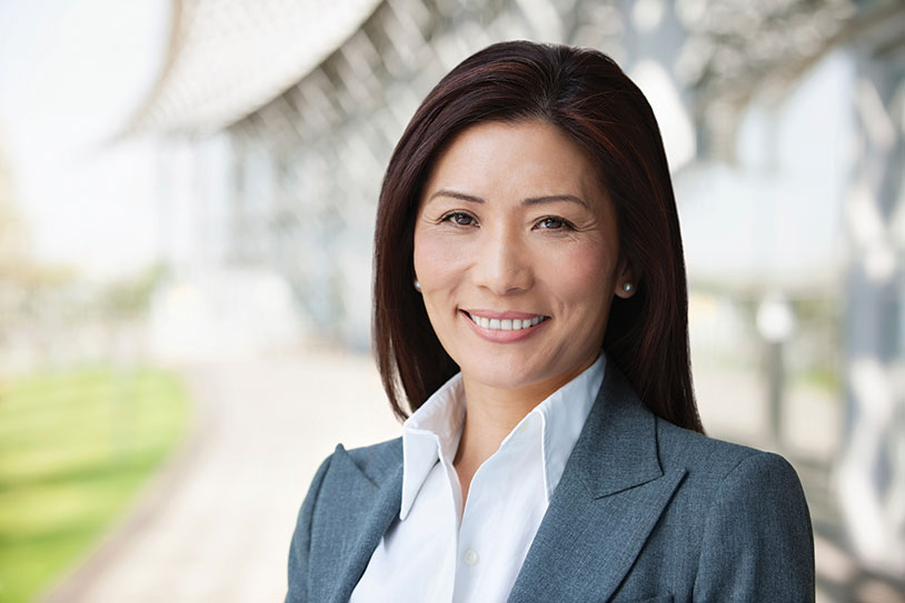 A woman smiling. Links to Gifts from Retirement Plans