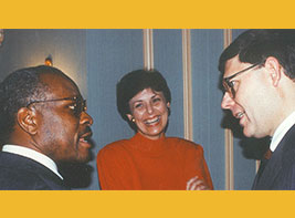 Preston Dean, right, talks to Clarence Thomas as Cathy Dean looks on.